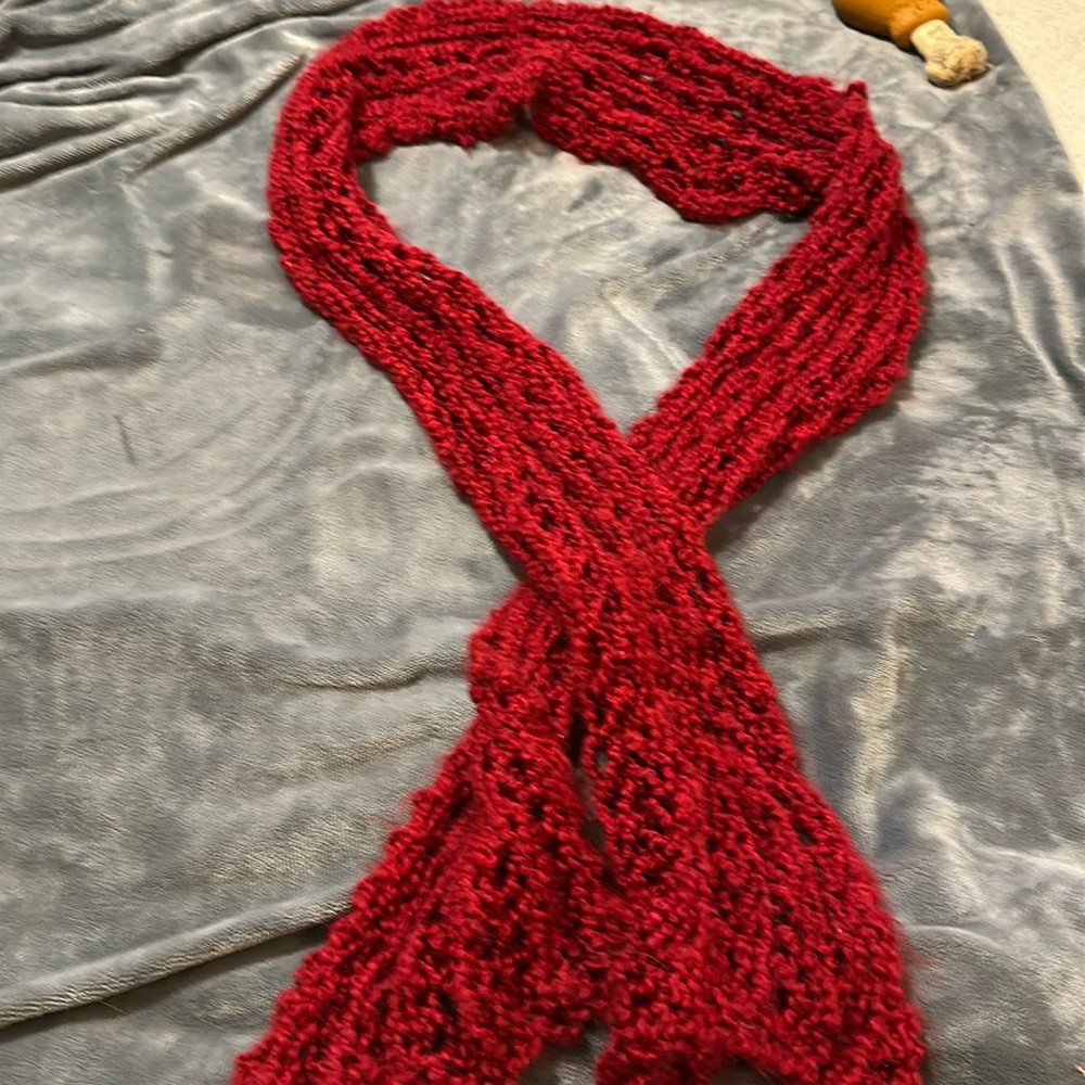 Hand knitted red scarf